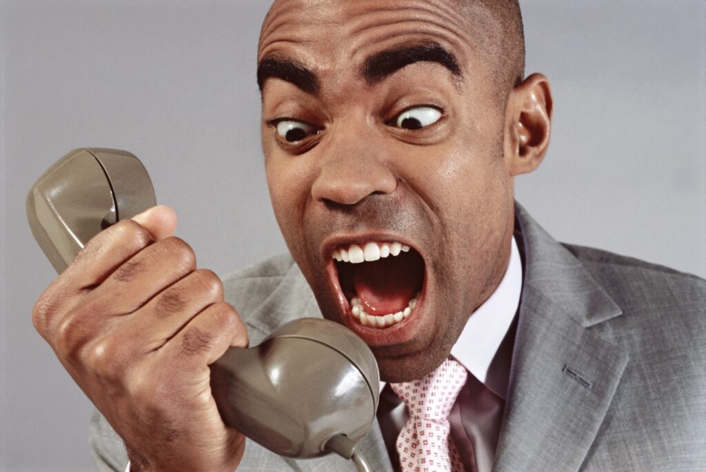 view of businessman screaming into phone 2026 01 11 09 59 50 utc from ACI