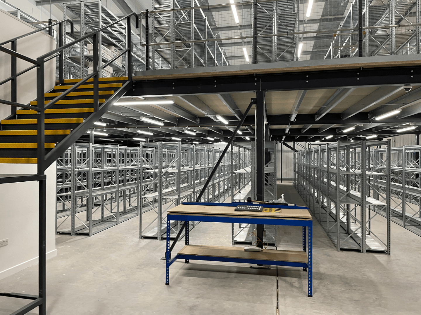 Warehouse shelving beneath mezzanine floor at Cromwell Tools Bristol Hub fit out project